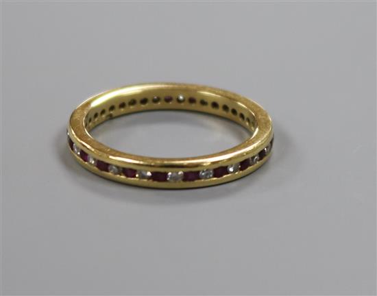 An 18ct gold, ruby and diamond full eternity ring, size M/N